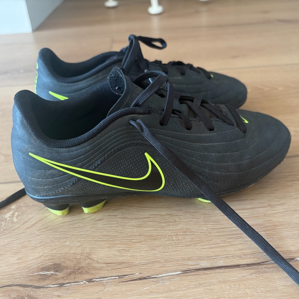 Nike Kids Black Cleats with Neon Yellow Swoosh